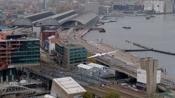 Avy aera flying by Amsterdam Central Station